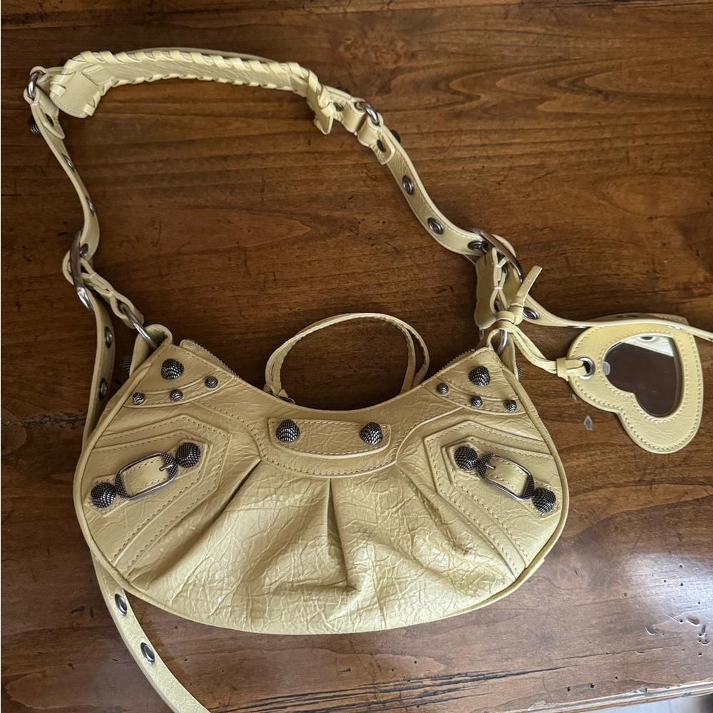 BALENCIAGA Le Cagole leather handbag Never worn, with tag light pale yellow